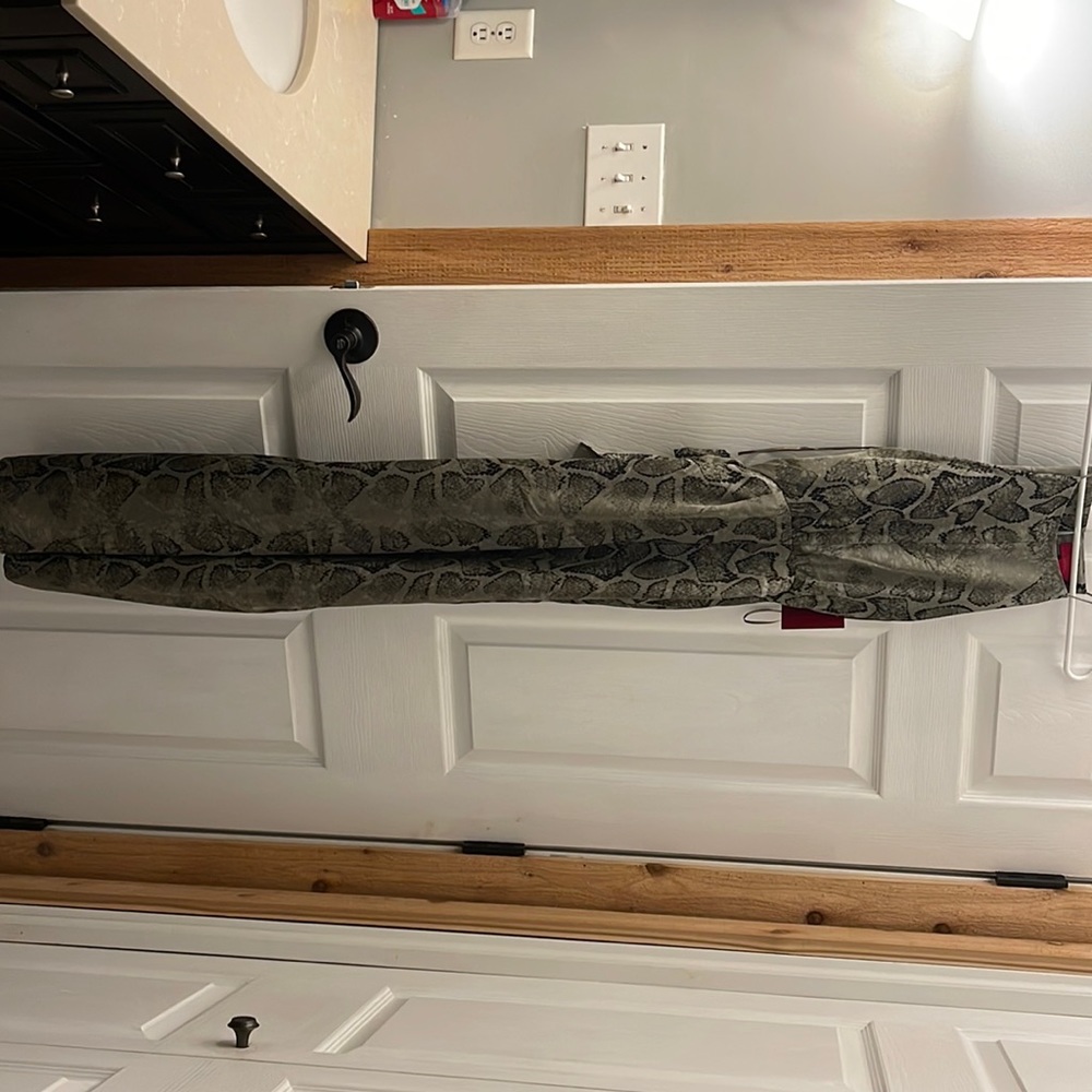 Jennifer Lopez snake print jumpsuit extra small.